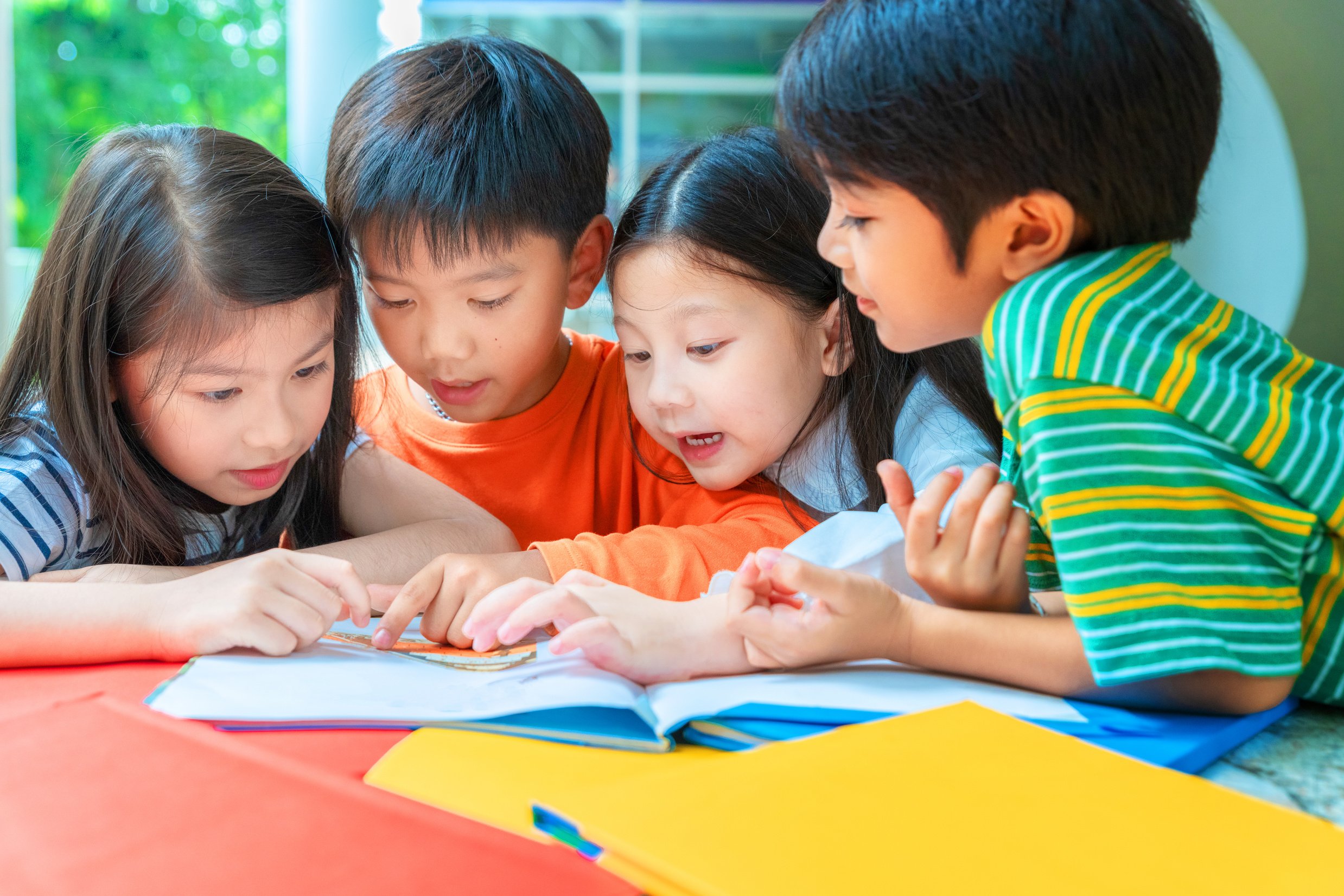 Asian Little Children Reading Book Cheerful